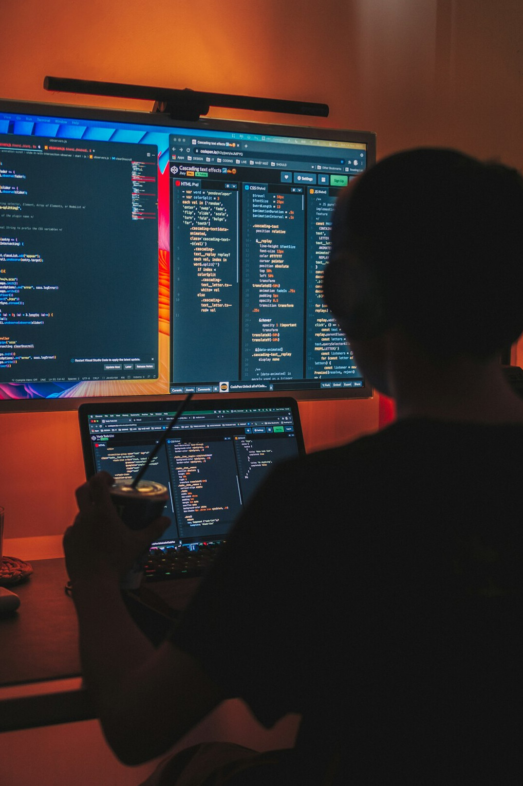 student coding at desk
